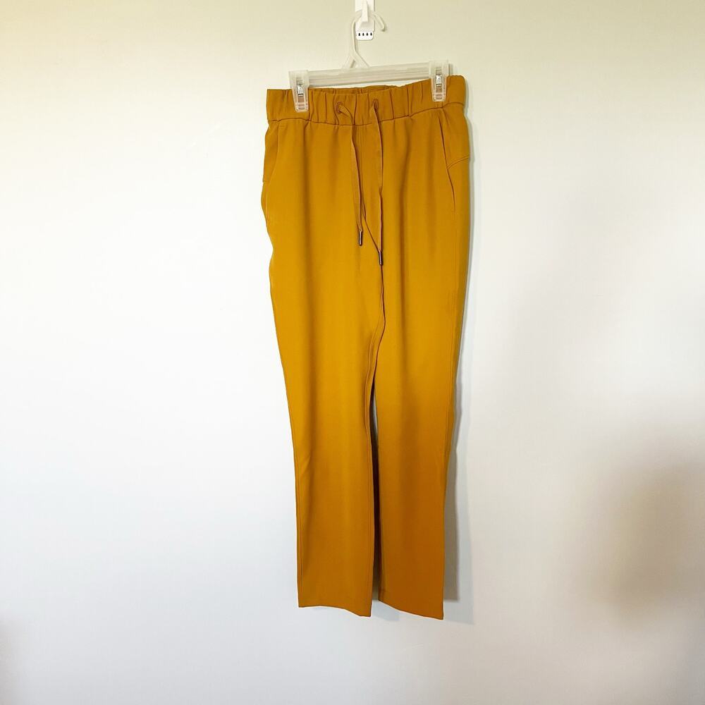 Lululemon On the Fly 7/8 Pant Woven Fools Gold size 2
